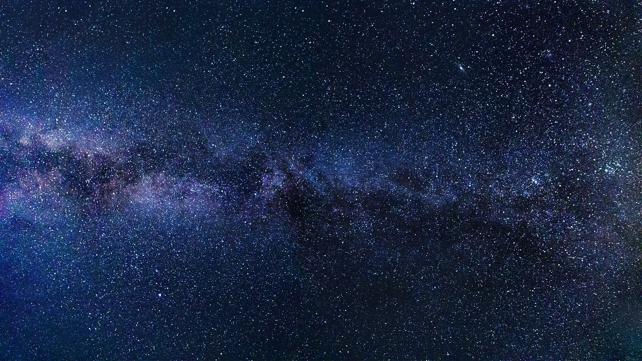 Picture of the Milky Way in blues and purples, courtesy of Pixabay.